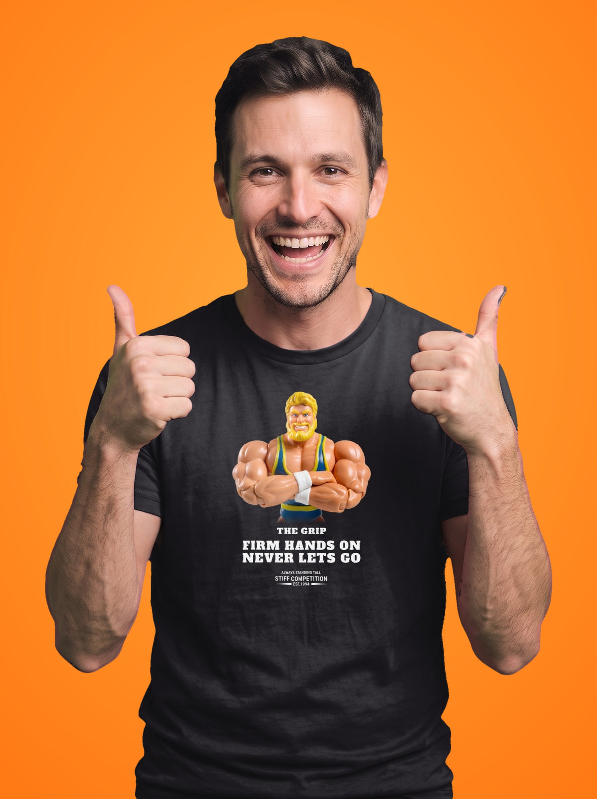 Man wearing the Grip Firm Hands On, Never Lets Go t-shirt in black